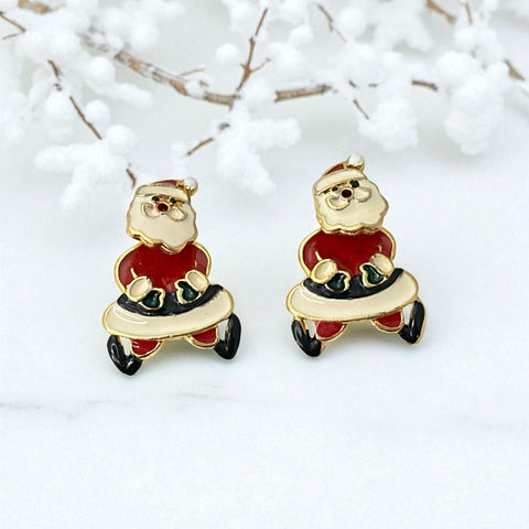 Vintage AIM Santa earrings with red, white, and black enamel, signed with copyright mark, featuring movable head and pierced stud design.
