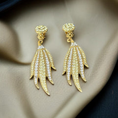 Vintage gold-tone clip-on earrings with jonquil and clear rhinestones in a feather-like Art Deco revival design; long dangle silhouette, 1970s style.