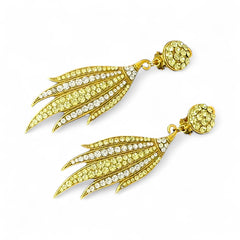 Vintage gold-tone clip-on earrings with jonquil and clear rhinestones in a feather-like Art Deco revival design; long dangle silhouette, 1970s style.