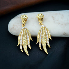 Vintage gold-tone clip-on earrings with jonquil and clear rhinestones in a feather-like Art Deco revival design; long dangle silhouette, 1970s style.