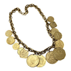 Vintage Franklin Mint Caribbean Coins necklace from the 1980s, featuring 14 uncirculated 24k gold-plated coins from Caribbean Islands on a textured chain.