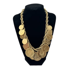 Vintage Franklin Mint Caribbean Coins necklace from the 1980s, featuring 14 uncirculated 24k gold-plated coins from Caribbean Islands on a textured chain.