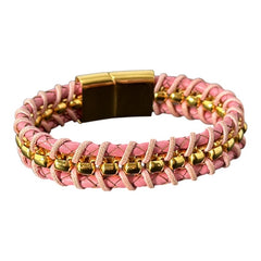 Elegant Daniel Steiger Melrose bracelet featuring braided pink leather on each side of yellow gold-plated center links, finished with a gold-plated magnetic slide clasp, photographed against a neutral backdrop.