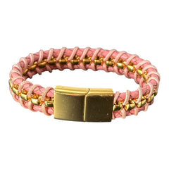 Elegant Daniel Steiger Melrose bracelet featuring braided pink leather on each side of yellow gold-plated center links, finished with a gold-plated magnetic slide clasp, photographed against a neutral backdrop.