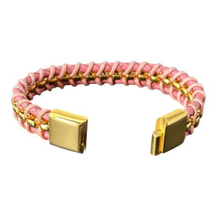 Elegant Daniel Steiger Melrose bracelet featuring braided pink leather on each side of yellow gold-plated center links, finished with a gold-plated magnetic slide clasp, photographed against a neutral backdrop.