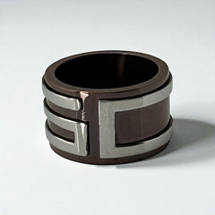 Dolce & Gabbana men's stainless steel ring with brown finish and raised silver-tone logo; bold designer accessory in size 8.5 with wide band styling.