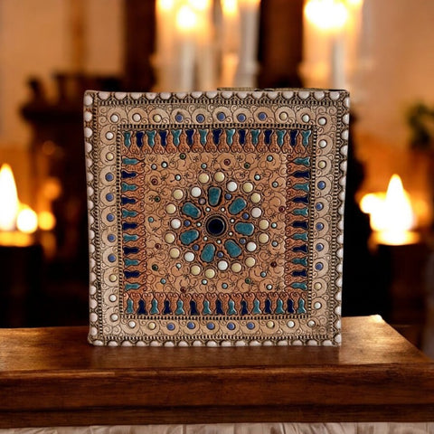 Vintage French studio pottery decorative tile by Paul Dordet, crafted in the 1950s-1960s. Features intricate geometric patterns impressed on buff and terracotta-colored clay, with enameled circles and shapes in cream, light blue, and black. Signed 'Dordet' and in excellent vintage condition, this collectible piece embodies sustainable craftsmanship and timeless artistry.