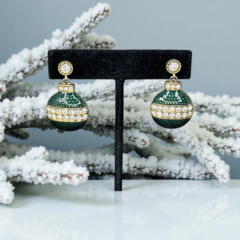 Vintage Eisenberg Ice Christmas ornament earrings with green enamel, clear rhinestone band, and gold-tone stud; signed and festive dangle design.