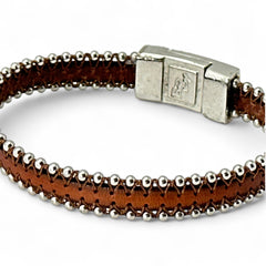 Erica Zap signed brown leather bracelet with silver-tone beaded edges and a textured magnetic clasp, modern artisan design in very good condition.