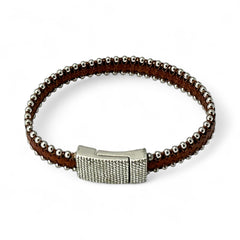 Erica Zap signed brown leather bracelet with silver-tone beaded edges and a textured magnetic clasp, modern artisan design in very good condition.