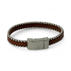 Erica Zap signed brown leather bracelet with silver-tone beaded edges and a textured magnetic clasp, modern artisan design in very good condition.