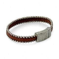 Erica Zap signed brown leather bracelet with silver-tone beaded edges and a textured magnetic clasp, modern artisan design in very good condition.