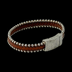 Erica Zap signed brown leather bracelet with silver-tone beaded edges and a textured magnetic clasp, modern artisan design in very good condition.