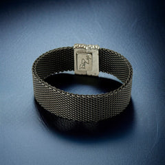 Signed Erica Zap bracelet in black nickel mesh with rhodium-plated magnetic clasp, 7-inch size, ¾-inch width, contemporary sculptural design, excellent condition.