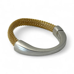 Signed Erica Zap bracelet featuring a woven 18K gold electroplated mesh band and a matte silver-tone crescent magnetic clasp. Artisan design with sculptural contrast between textures and tones. Shown from multiple angles to highlight clasp detail, mesh construction, and overall condition.