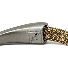 Signed Erica Zap bracelet featuring a woven 18K gold electroplated mesh band and a matte silver-tone crescent magnetic clasp. Artisan design with sculptural contrast between textures and tones. Shown from multiple angles to highlight clasp detail, mesh construction, and overall condition.