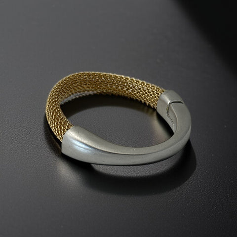 Signed Erica Zap bracelet featuring a woven 18K gold electroplated mesh band and a matte silver-tone crescent magnetic clasp. Artisan design with sculptural contrast between textures and tones. Shown from multiple angles to highlight clasp detail, mesh construction, and overall condition.