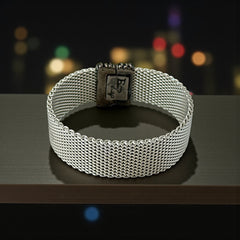 Erica Zap rhodium-plated mesh bracelet in black nickel finish with sculptural silhouette and magnetic clasp, likely new old stock.