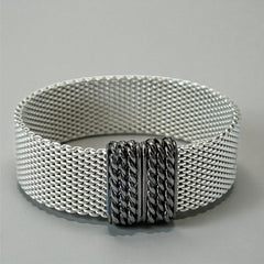 Erica Zap rhodium-plated mesh bracelet in black nickel finish with sculptural silhouette and magnetic clasp, likely new old stock.
