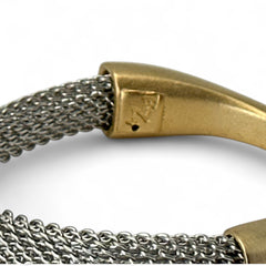 Signed Erica Zap bracelet featuring a rhodium-plated woven mesh band and a matte 18K gold electroplated crescent clasp. Sculptural magnetic closure with mixed-metal contrast. Shown from multiple angles to highlight clasp detail, mesh texture, and overall condition.