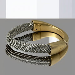 Signed Erica Zap bracelet featuring a rhodium-plated woven mesh band and a matte 18K gold electroplated crescent clasp. Sculptural magnetic closure with mixed-metal contrast. Shown from multiple angles to highlight clasp detail, mesh texture, and overall condition.
