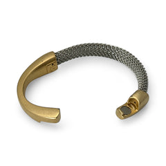 Signed Erica Zap bracelet featuring a rhodium-plated woven mesh band and a matte 18K gold electroplated crescent clasp. Sculptural magnetic closure with mixed-metal contrast. Shown from multiple angles to highlight clasp detail, mesh texture, and overall condition.