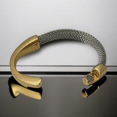Signed Erica Zap bracelet featuring a rhodium-plated woven mesh band and a matte 18K gold electroplated crescent clasp. Sculptural magnetic closure with mixed-metal contrast. Shown from multiple angles to highlight clasp detail, mesh texture, and overall condition.