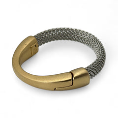 Signed Erica Zap bracelet featuring a rhodium-plated woven mesh band and a matte 18K gold electroplated crescent clasp. Sculptural magnetic closure with mixed-metal contrast. Shown from multiple angles to highlight clasp detail, mesh texture, and overall condition.