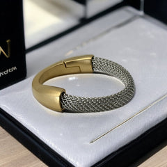 Signed Erica Zap bracelet featuring a rhodium-plated woven mesh band and a matte 18K gold electroplated crescent clasp. Sculptural magnetic closure with mixed-metal contrast. Shown from multiple angles to highlight clasp detail, mesh texture, and overall condition.