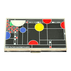 Acme Studio business/credit card case featuring Frank Lloyd Wright's 'Playhouse' design, showcasing geometric patterns with red, yellow, and blue accents on a black background, crafted with mirror chrome metal finish and lacquer-filled acid-etched image.