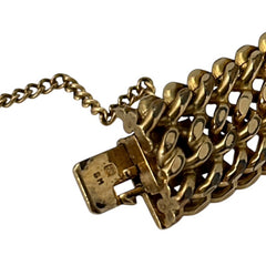 Vintage French gold-plated curb mesh bracelet from the 1960s/70s, featuring three soldered curb chains with a textured mesh design, a safety catch clasp with a safety chain, and intriguing marks (5M and an unclear jeweler's signature). Measures 8 inches long and showcases light vintage wear.