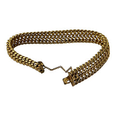 Vintage French gold-plated curb mesh bracelet from the 1960s/70s, featuring three soldered curb chains with a textured mesh design, a safety catch clasp with a safety chain, and intriguing marks (5M and an unclear jeweler's signature). Measures 8 inches long and showcases light vintage wear.