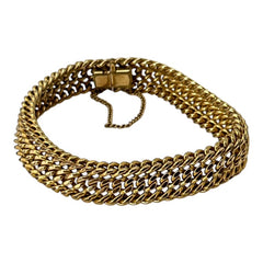 Vintage French gold-plated curb mesh bracelet from the 1960s/70s, featuring three soldered curb chains with a textured mesh design, a safety catch clasp with a safety chain, and intriguing marks (5M and an unclear jeweler's signature). Measures 8 inches long and showcases light vintage wear.