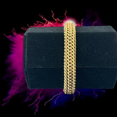 Vintage French gold-plated curb mesh bracelet from the 1960s/70s, featuring three soldered curb chains with a textured mesh design, a safety catch clasp with a safety chain, and intriguing marks (5M and an unclear jeweler's signature). Measures 8 inches long and showcases light vintage wear.
