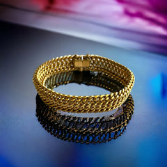 Vintage French gold-plated curb mesh bracelet from the 1960s/70s, featuring three soldered curb chains with a textured mesh design, a safety catch clasp with a safety chain, and intriguing marks (5M and an unclear jeweler's signature). Measures 8 inches long and showcases light vintage wear.