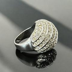 Vintage French silver-tone cocktail ring from the 1990s, featuring diagonal rows of clear pave rhinestones in a high rounded design, in very good vintage condition.