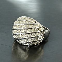 Vintage French silver-tone cocktail ring from the 1990s, featuring diagonal rows of clear pave rhinestones in a high rounded design, in very good vintage condition.