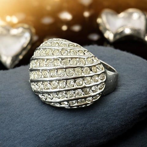Vintage French silver-tone cocktail ring from the 1990s, featuring diagonal rows of clear pave rhinestones in a high rounded design, in very good vintage condition.