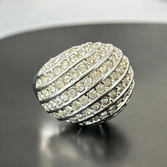 Vintage French silver-tone cocktail ring from the 1990s, featuring diagonal rows of clear pave rhinestones in a high rounded design, in very good vintage condition.