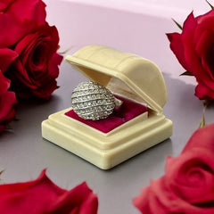 Vintage French silver-tone cocktail ring from the 1990s, featuring diagonal rows of clear pave rhinestones in a high rounded design, in very good vintage condition.