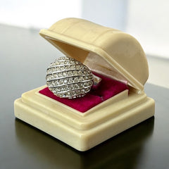 Vintage French silver-tone cocktail ring from the 1990s, featuring diagonal rows of clear pave rhinestones in a high rounded design, in very good vintage condition.