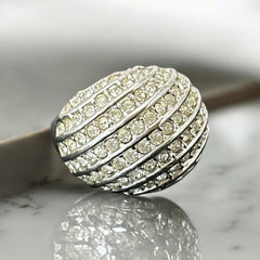 Vintage French silver-tone cocktail ring from the 1990s, featuring diagonal rows of clear pave rhinestones in a high rounded design, in very good vintage condition.