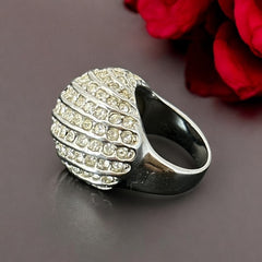 Vintage French silver-tone cocktail ring from the 1990s, featuring diagonal rows of clear pave rhinestones in a high rounded design, in very good vintage condition.