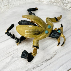 Signed Hattie Carnegie vintage bug brooch with yellow enamel coat, black top hat, turquoise cabochons, and gold-tone details—whimsical mid-century costume jewelry