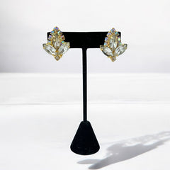 Verified Juliana #1402 vintage clear rhinestone and gold-tone floral brooch with matching clip-on earrings. The brooch features dimensional layered rings of clear chaton and AB rhinestones, with marquise rhinestones encircling the center. Earrings showcase a leaf-shaped design with marquise rhinestones and AB chaton accents. Mid-century elegance from the late 1950s or early 1960s.