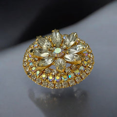 Verified Juliana #1402 vintage clear rhinestone and gold-tone floral brooch with matching clip-on earrings. The brooch features dimensional layered rings of clear chaton and AB rhinestones, with marquise rhinestones encircling the center. Earrings showcase a leaf-shaped design with marquise rhinestones and AB chaton accents. Mid-century elegance from the late 1950s or early 1960s.