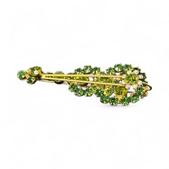Vintage Juliana violin brooch in gold tone metal with green and peridot rhinestones, featuring layered construction and floral accents; verified design #3151 from the 1960s, shown from front and back.