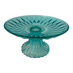 A vibrant aqua blue pressed glass footed dish with a diamond pattern, versatile for serving desserts, fruit, or candy, mid-century design.