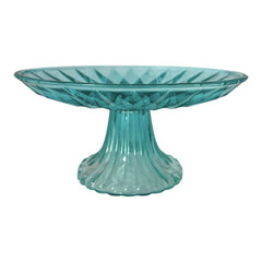A vibrant aqua blue pressed glass footed dish with a diamond pattern, versatile for serving desserts, fruit, or candy, mid-century design.