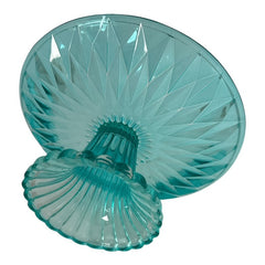 A vibrant aqua blue pressed glass footed dish with a diamond pattern, versatile for serving desserts, fruit, or candy, mid-century design.